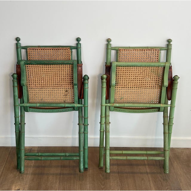Mid-Century Modern Pair of 1970s folding safari chairs in weathered faux bamboo with caned backs and seats For Sale - Image 3 of 12