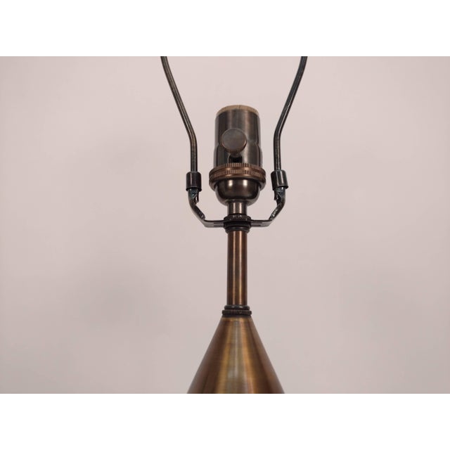 Pair of handmade conical table lamps with antique brass finish.