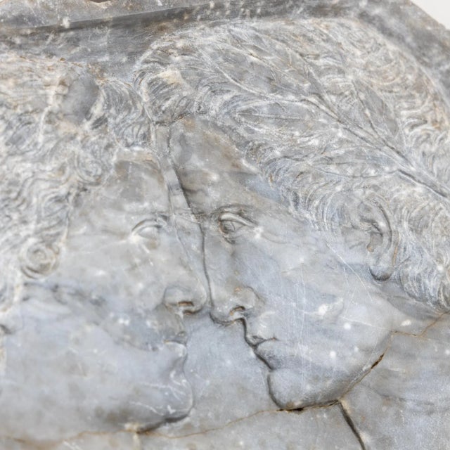 Bas-relief in gray marble with the profile portraits of Josephine and Napoleon. Glued break.