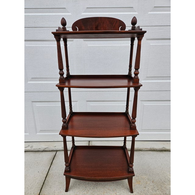 This four-tier mahogany etagere with graduated shelves is by Imperial Furniture out of Grand Rapids, Michigan. Fluted...