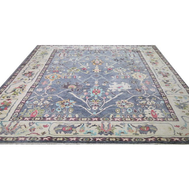 Vintage Turkish Angora wool hand knotted Oushak rug with natural colors and all over design.