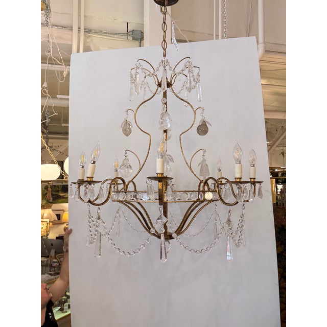 Design Plus Gallery presents a Mid 20th Century Brazilian Rock Crystal Chandelier. This ornate chandelier has a gilt metal...