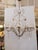 Design Plus Gallery presents a Mid 20th Century Brazilian Rock Crystal Chandelier. This ornate chandelier has a gilt metal...