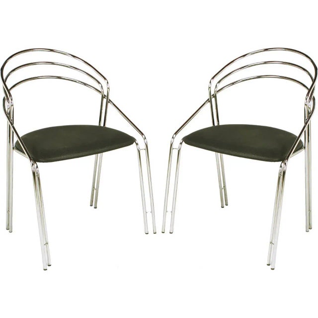 Pair of chromed and bent steel Postmodern Italian side chairs. Multiple bars of chromed steel with thin chromed steel...