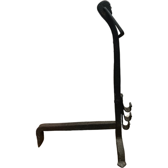 Pair of split hook andirons from the late 18th/early 19th century. This pair stands out from others with their distinct...