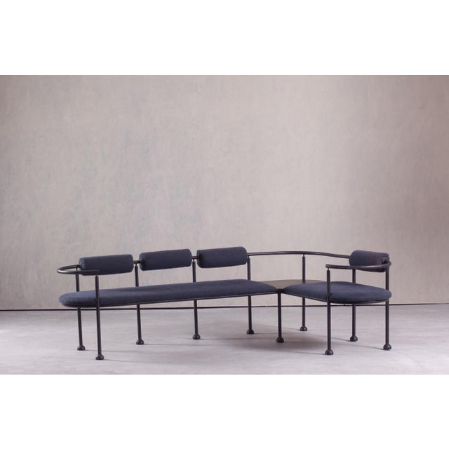 This rare sculptural postmodern bench was made in Italy during the 1990s. Featuring a matte black steel frame and fabric...