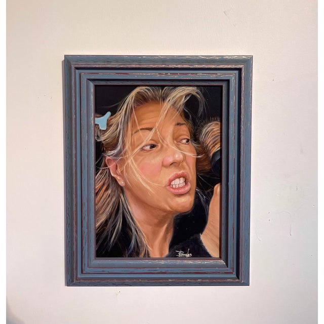 This oil on panel artwork captures a dynamic moment, depicting a woman with expressive features and flowing hair,...