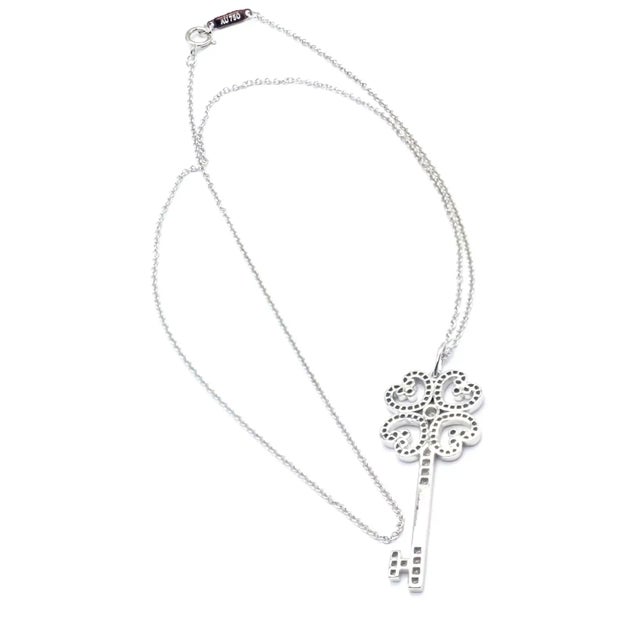 Metal Edit Late 20th Century Tiffany & Co. Platinum & White Gold Enchant Quatra Heart Key Pendant Necklace For Sale - Image 7 of 11