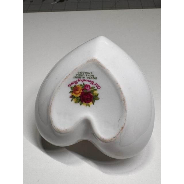 Vintage Royal Albert Old Country Roses heart-shaped trinket box, crafted in fine bone china in England. This romantic...