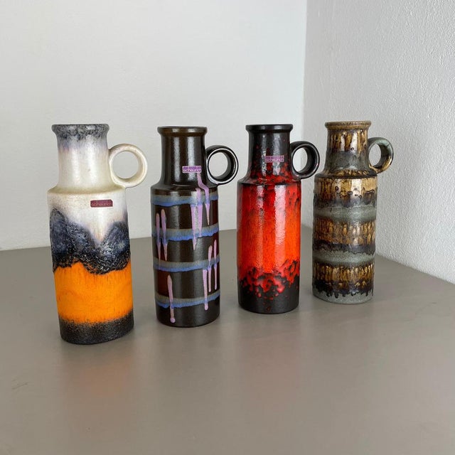Article: Set of four fat lava art vases. Producer: Scheurich, Germany. Decade: 1970s. These original vintage vases was...