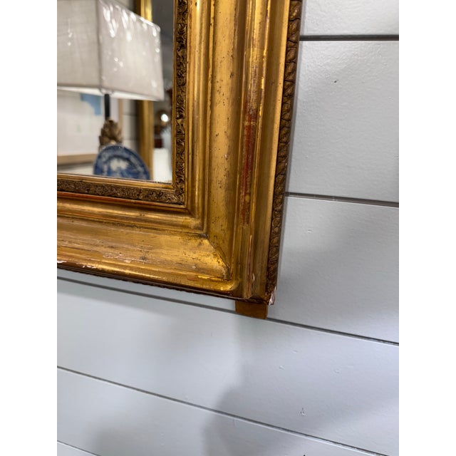 A beautiful arched Louis Phillippe mirror with gold leafed frame, this can make a wonderful accent in a powder bath, above...