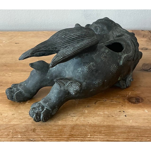 This exquisite vintage bronze censer takes the form of a Shi Shi lion, also known as a Foo Dog, a traditional symbol of...