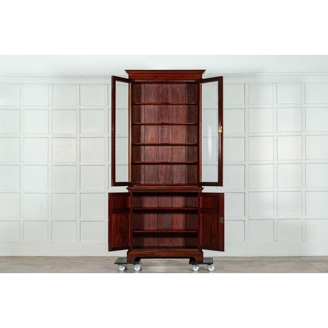 Circa 1870 19th century english mahogany glazed bookcase. Base w96 x d33 x h91 cm top w101 x d28 x h145 cm together w101 x...