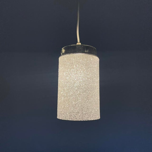 Striking vintage pendant light with a sculptural shade made from translucent acrylic, formed from countless tiny irregular...