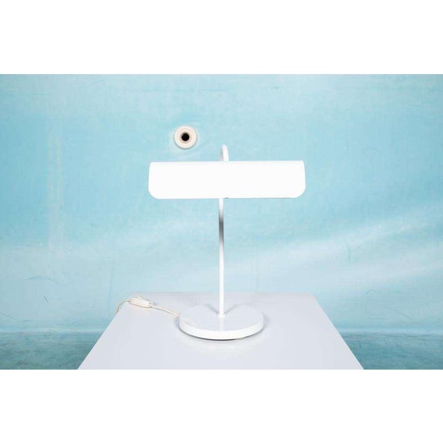 Minimalistically designed notary lamp from the seventies, made entirely of medium. A tendril, organically curved rod runs...
