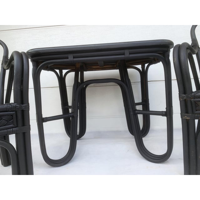 Rattan and bamboo furniture set – table and 3 chairs, colonial style Solid furniture, made of bent rattan/bamboo, in black...