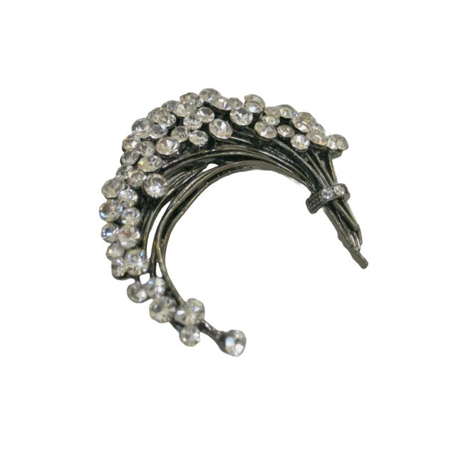 This is part of Chairish’s Costume Jewelry assortment. Vintage hematite clear brilliant crystal stunning crescent fold...
