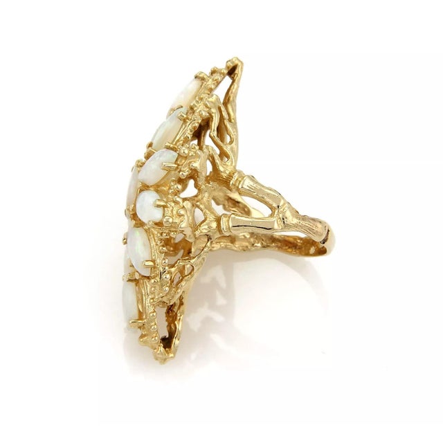 This stunning estate ring is crafted from solid 14k yellow gold with a polished and textured finish. The top is a long...