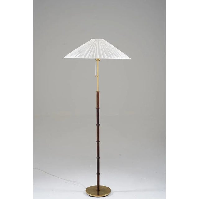 Lovely floor lamp in brass and rosewood by Falkenbergs, Sweden, 1960s. The design is simple and lets the attention focus...