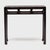 This narrow console table from the late 19th century balances streamlined form with the rich textures of antique...