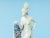 Art Deco character from the 1920s. Decorative porcelain dancer with a hand-painted cape and hat typical of the time....