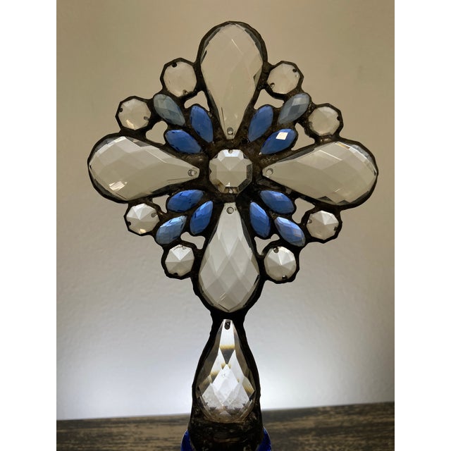 This one-of-a-kind assemblage sculpture pairs a cobalt-blue glass bottle with a handcrafted cross composed of faceted...