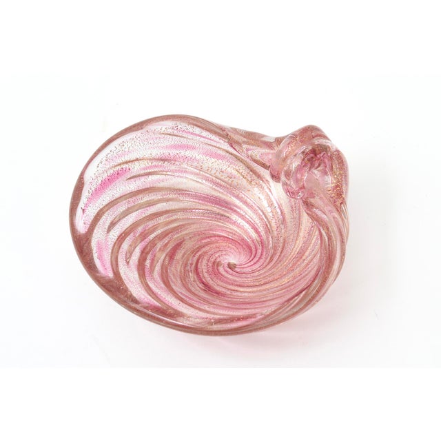 This lovely vintage small Murano style blown glass bowl is of a coiled snail form. it has swirls of gold aventurine with...