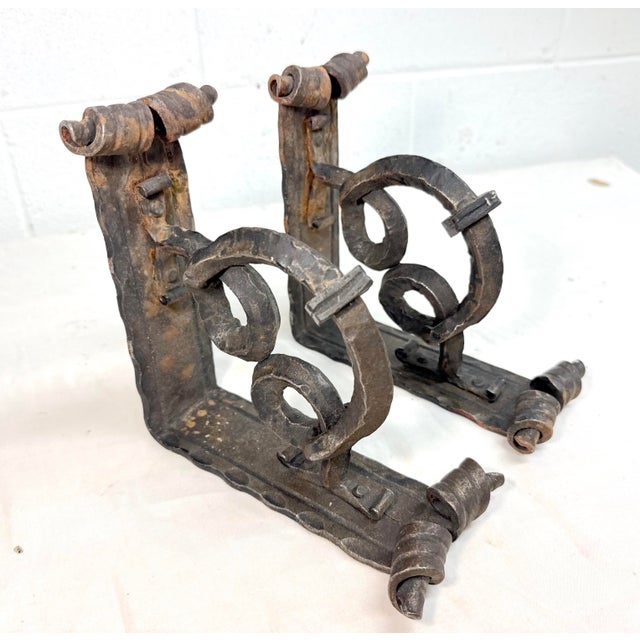 Up for sale is an exquisite pair of antique hand made wrought iron wall bracket corbels. These very elaborately made...