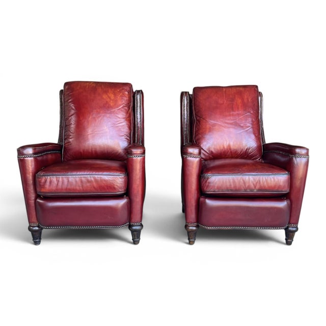 Rich patina oxblood leather, timeless English-inspired styling, and exceptional comfort make this pair of 1980s recliners...