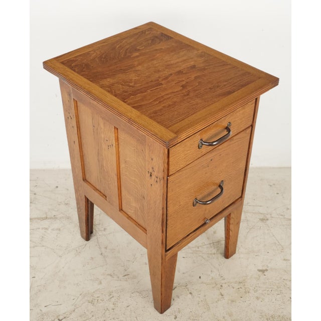 Vintage Arts & Crafts filing cabinet stand with a small pull out drawer and a lower file drawer, both with iron pulls....