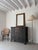 An elegant French wall mirror in a striking yet simple neoclassical design. The gilt wood frame features reeded detail and...