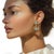 Kenneth Jay Lane 18K gold plated mixed metals clear Swarovski crystal double starburst drop earrings from 2012. Luxury...