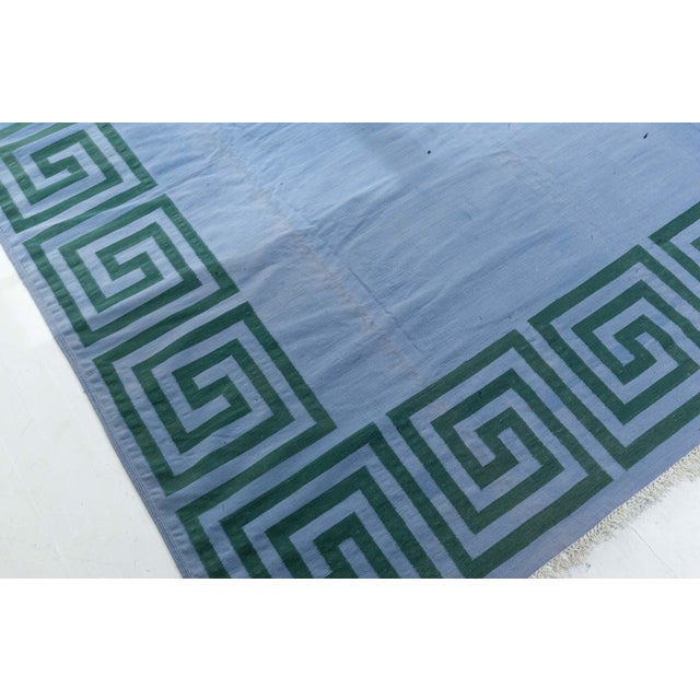 Vintage Indian Dhurrie rug Size: 17'1" × 17'10" (520 × 543 cm) Infuse your space with bold simplicity and cultural...