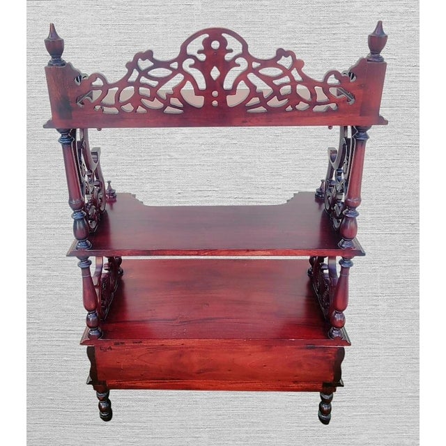 A beautiful cherry red 3 shelf fretwork etagere shelving unit. This is a beautiful etagere with intricate unique detailed...