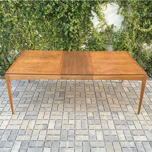 Vintage mid century modern walnut and ashwood dining table from Lane’s iconic “Rhythm” collection, produced in Altavista,...