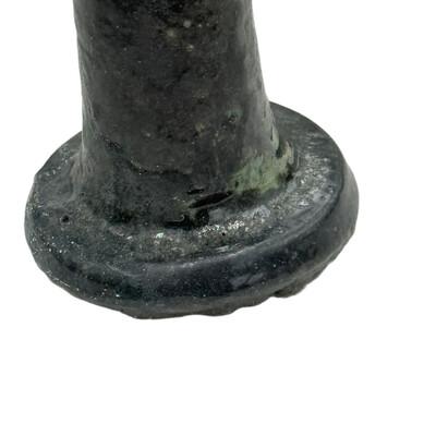 A Moroccan Tamegroute glazed candlestick holder is a handcrafted piece made in the historic pottery village of Tamegroute...