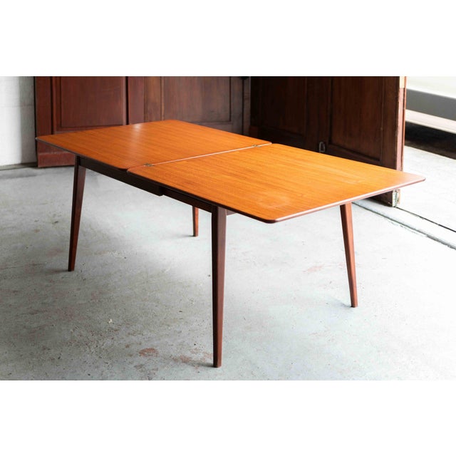This flip-flop dining table was designed by Louis Van Teeffelen and produced by Wébé in the Netherlands in the 1960’s....