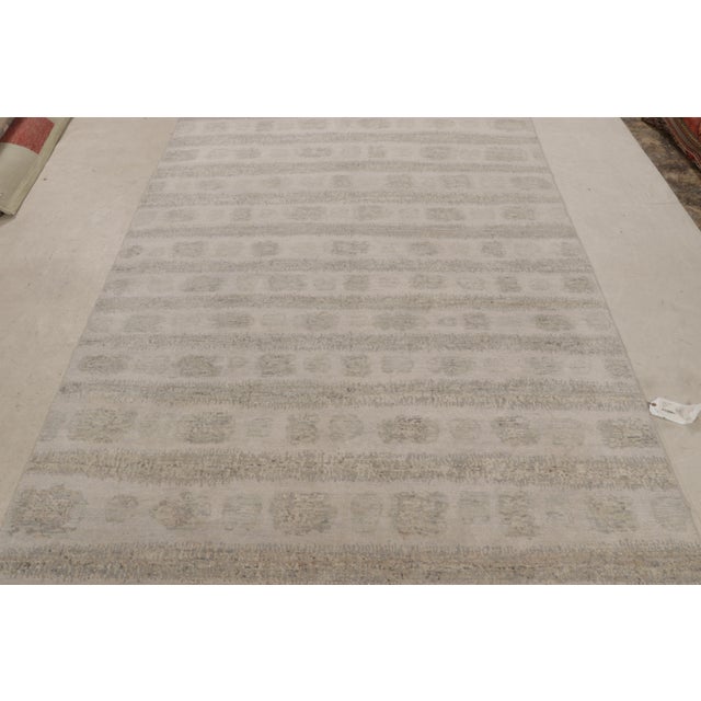 Hand-knotted in wool, this 6x9 modern abstract rug with geometric patterns features both contemporary and textural design...
