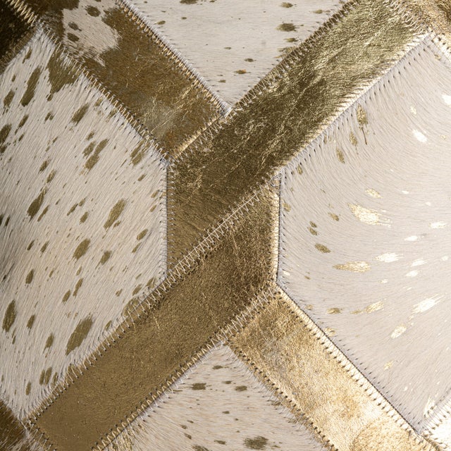 Bold geometry, shimmering metallic accents, and exceptional craftsmanship come together in this 16 x 24 inch genuine...