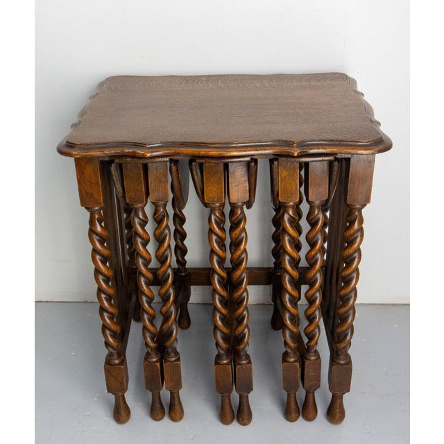 Set of four vintage nesting tables English made circa 1940, massive oak with turned legs. The set consists of a large...