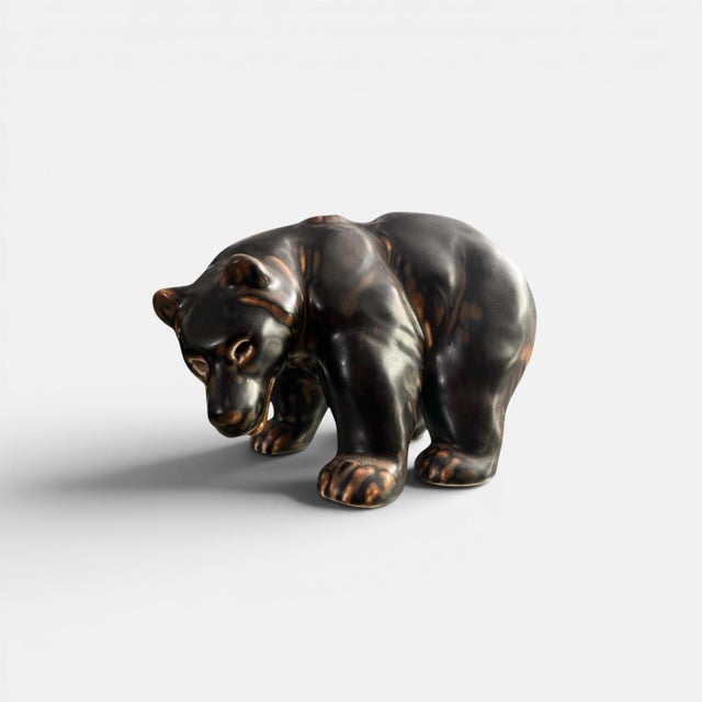 Royal Copenhagen Bear Figurine by Knud Kyhn, Flambé Glaze, 1950s Striking mid-century bear sculpture designed by Knud Kyhn...