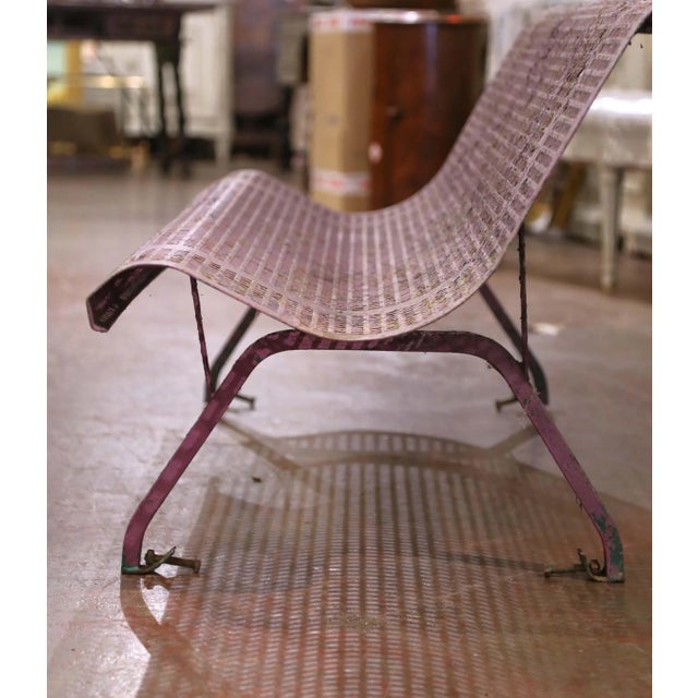 Add vintage character to a garden, patio, or terrace with this unusual antique French iron bench. Crafted in France circa...
