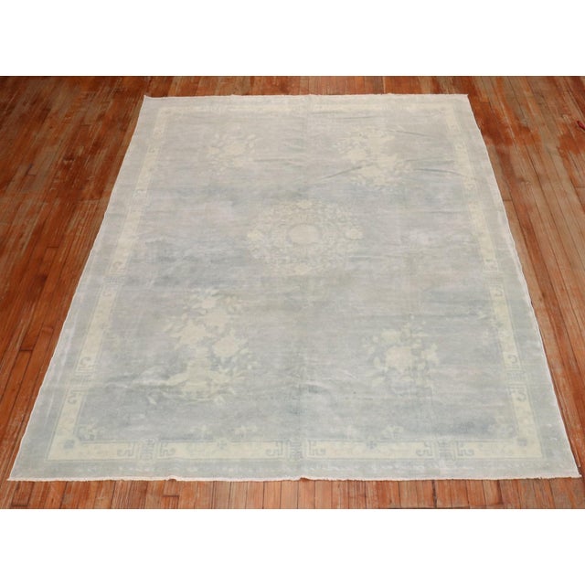 an early 20th Century Light blue and ivory chinese rug