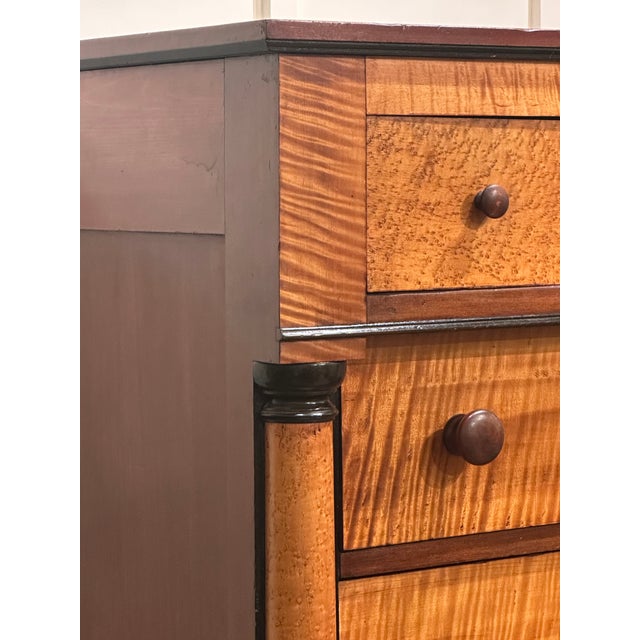 This curly maple chest offers plenty of storage and the wood is just spectacular. Ebonized columns emphasize the contrast...