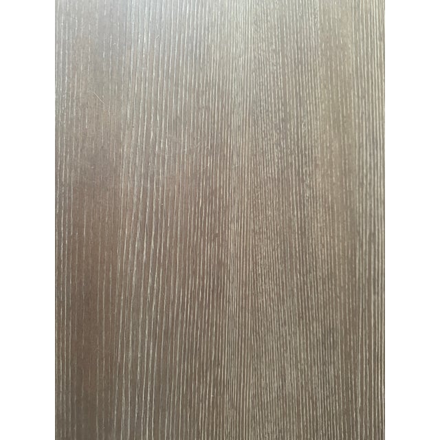 Hand-applied matte Monterey grey washed finish highlights the wood's rich, open grain. Two separate cabinets are each...