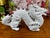 A vintage white glazed ceramic dragon sculpture featuring expressive movement and finely detailed scales. Made in Mexico,...