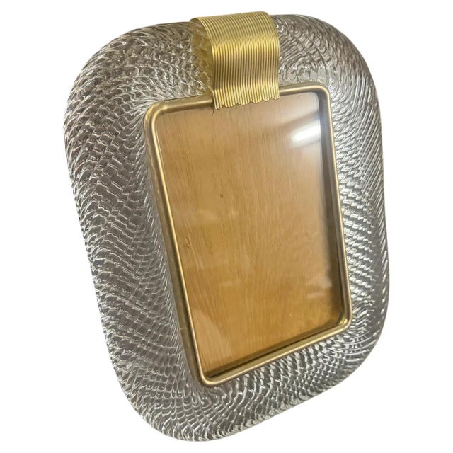 A clear Murano glass picture frame designed and manufactured in Venice in the style of Barovier, in lovely condition. The...