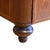 A Biedermeier-style chest of drawers, made of wood and finished with veneer. The front is adorned with subtle inlay in the...