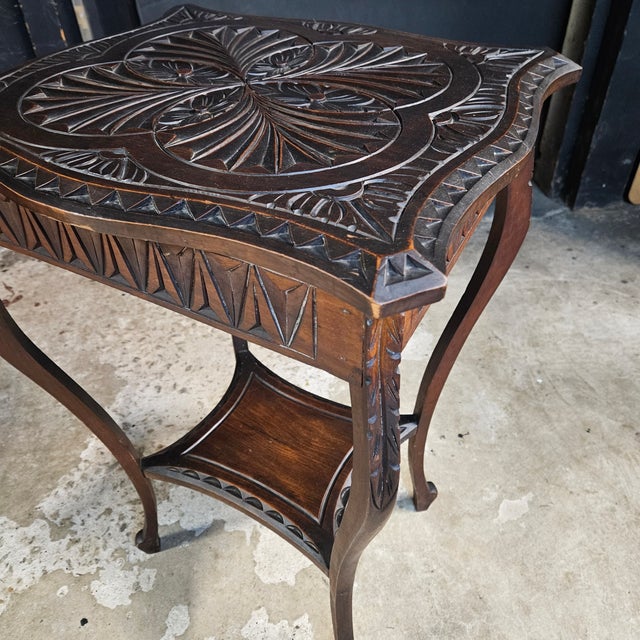 This Pretty English Oak Carved Top Shaped Leg Side Table would make a beautiful accent table in a living room, study, or...