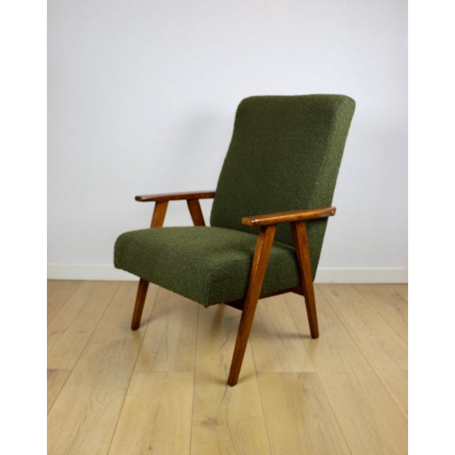 Vintage loft design armchair in green olive high boucle fabric. Loft design vintage armchair from the 1970s. Completely...